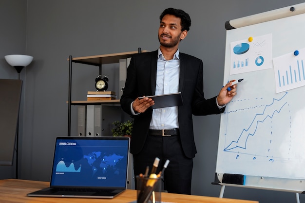 business person looking finance graphs 23 21504613321